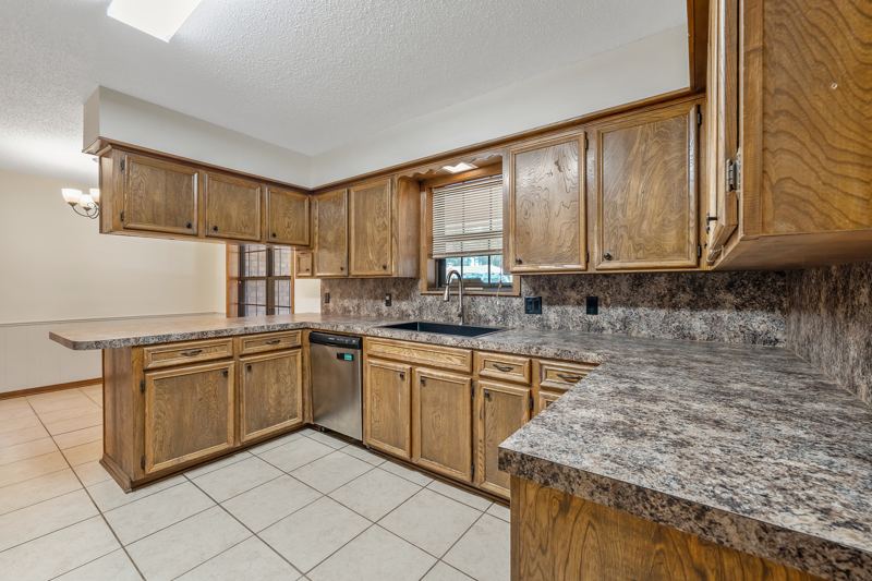 Kitchen with abundant cabinetry and a breakfast bar